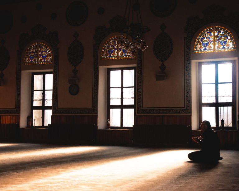 photo of person praying indoors